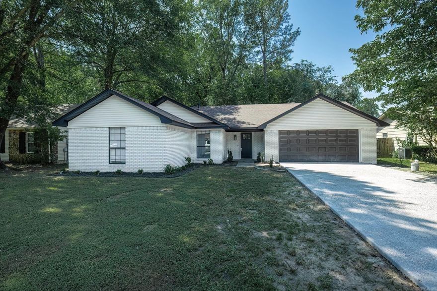 Welcome to this beautifully remodeled three-bedroom, two-bath home that effortlessly combines modern comforts with classic charm. Step inside to discover stunning LVP flooring that flows throughout the spacious living areas, creating a warm and inviting atmosphere. The heart of the home boasts a cozy gas fireplace, perfect for relaxing evenings. The kitchen and bathrooms have been tastefully updated, and a new water heater ensures efficiency and reliability. Outside, you'll find a fully fenced backyard, offering privacy and a safe space for children and pets to play. Additional features include a two-car garage, providing ample storage and convenience. This home is truly move-in ready, waiting for you to make it your own.