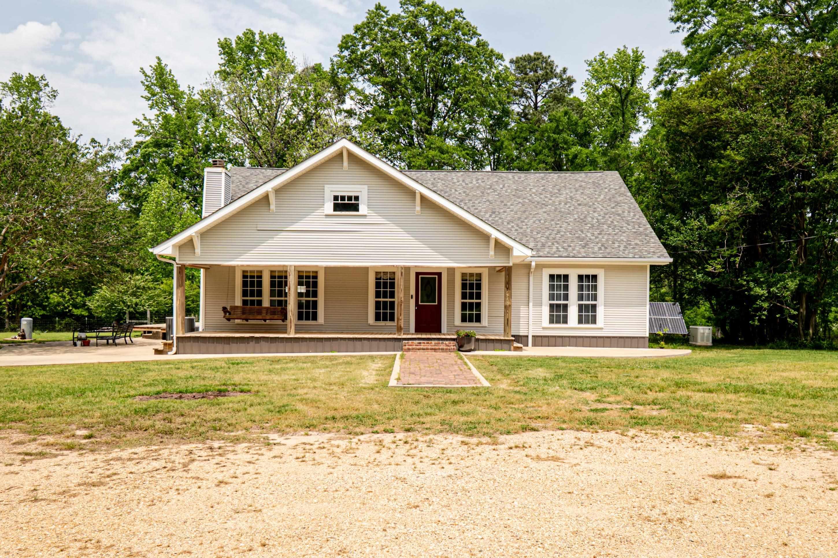 This stunning 3,200+ sq ft home on 5.05 fenced acres is the perfect blend of comfort, space, and modern convenience. Featuring 4 large bedrooms and 4 bathrooms, the layout offers two expansive living areas and an open-concept dining room and kitchen, ideal for entertaining. Recent updates include the roof, HVAC, plumbing, electrical systems, flooring, and a spacious outdoor patio/deck perfect for gatherings. The home also boasts an enclosed sunroom, solar panels, and a whole-home generator powered by a ~1,000-gallon butane tank to ensure uninterrupted power. The fenced acreage surrounding the house includes two additional fenced areas suitable for livestock or pets. A massive 50 Ć 60 shop on the property comes with a fully-equipped apartment featuring a full bath, walk-in closet, separate living/sleeping area, and a kitchen with a gas stove. This property is ideal for those seeking a spacious home with versatile outdoor spaces, modern upgrades, and energy independence. Schedule your showing today!