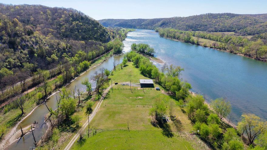 This 1.12 acre riverfront lot resides in the desirable White River Run II subdivision in Guion, Arkansas on the White River. This property offers a gentle slope to the water’s edge, making access easy and enjoyable, along with your own private beach area and mature trees providing natural shade and privacy. The lot is ready to enjoy with an established RV parking spot, private well, and existing electric, water, and sewer hookups already in place. Take in beautiful views of the White River along with the striking limestone bluffs that form a scenic backdrop. Conveniently located just 20 minutes from Mountain View, Arkansas, and near Anglers Resort and Jack’s Resort upstream, this property is ideal for fishing, recreation, or building your future river getaway. Priced at $55,000.