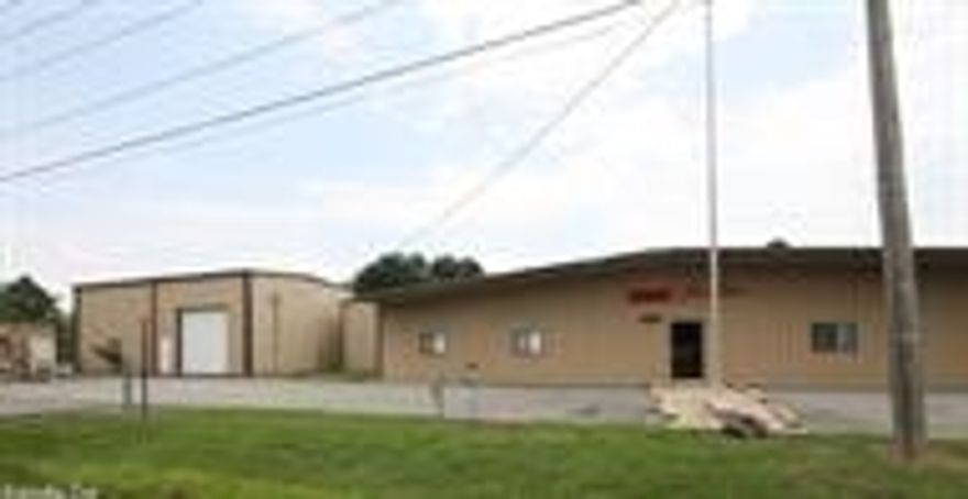 Excellent location w high traffic for business.  Has 8 offices & warehouse work areas.  Office space is appr 35% of total heat and cooled area.  There is a tenant inside so all showings must be scheduled through listing agent with 48 hr notice.