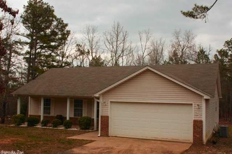 COUNTRY LIVING! Just past Greystone golf community you'll find this wonderful 3/2 home. Feel like you live in the country with amenities close by. Nice open floor plan, hardwood floors, and the great room has a cozy fireplace and vaulted ceiling. The kitchen features a pantry, bay window, and large eating area. Country front porch. Watch the wildlife play from your large wood deck. Lots of trees!