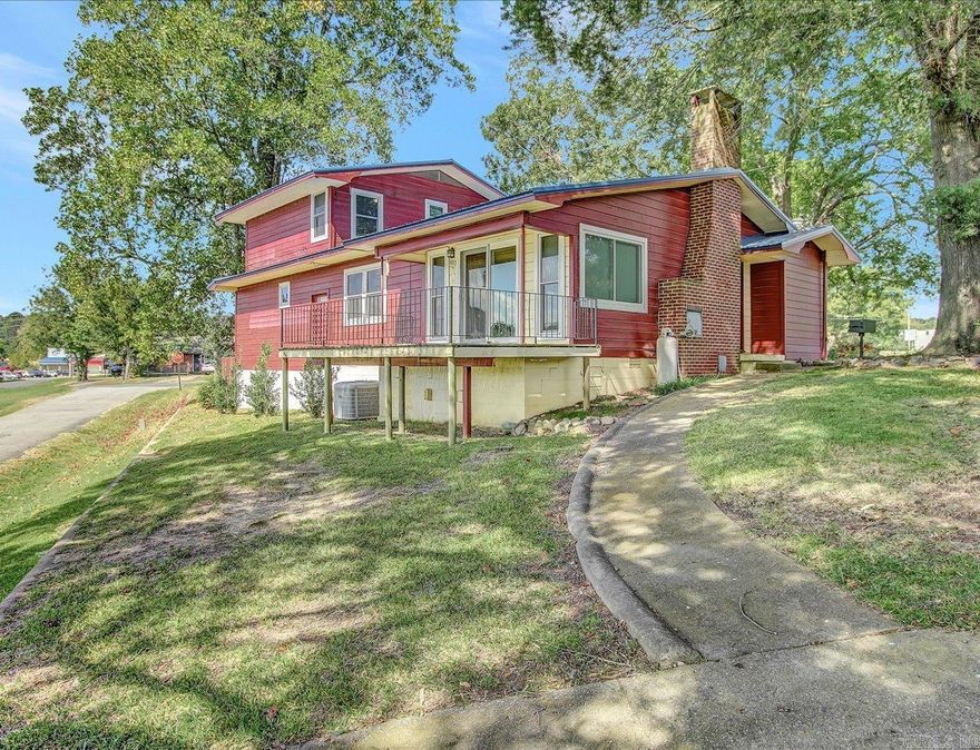 Lakefront living in Mena! Wake up to peaceful water views at this beautiful split-level home on Cox Lake. Enjoy vaulted ceilings with exposed beams, a cozy brick fireplace, and an open kitchen and dining area perfect for gatherings. Step out onto your deck overlooking the lake and soak in the serenity or grab your kayak for a morning paddle! Located near the new Mena bike trails, this is your chance to own a slice of lakeside paradise.