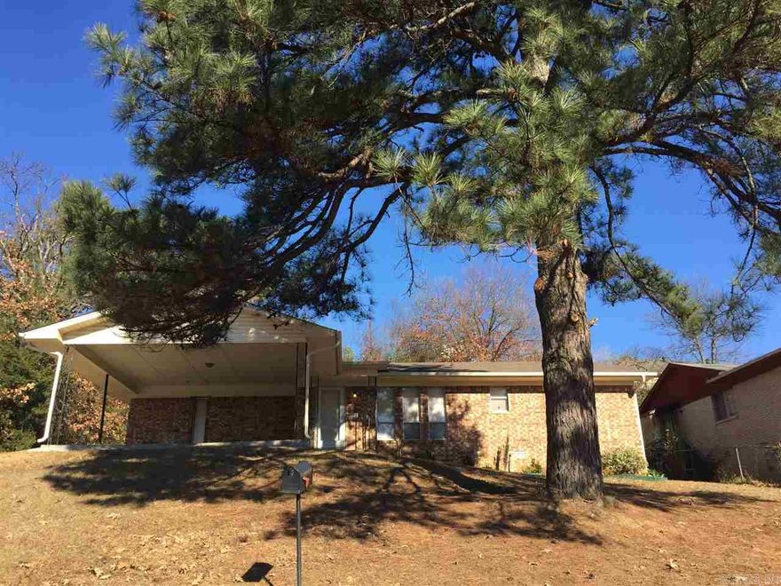 This home is very neat,  all new paint, 2 inch plantation shutters, new electric oven, washer and dryer room. 2 large baths , full shower in master bathroom, two double vanity sinks and decorator mirrors, new fan vent Large master bedroom , split bedroom plan , very unusual for this era home. Open dining to the breakfast bar area, patio doors out to the back area, fully natural view of mature trees for privacy and storage building.