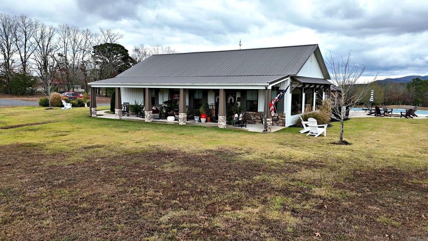 This one-of-a-kind 3 bedroom, 3 bath, 2,568 sq ft custom home by Dennis Salisbury Construction is an upscale barndominium-style retreat that perfectly blends luxury and the outdoors. Thoughtfully designed with an open living area and a dramatic wall of windows, it brings the stunning mountain views right inside, complemented by a cozy fireplace, shiplap walls, vaulted ceilings, granite countertops throughout, and gorgeous custom cabinetry. Each of the 3 bedroom suites offers its own private bath, with heated bathroom floors for added comfort, plus a small loft office, abundant built-ins, tons of storage, and even a storm shelter tucked inside the primary closet. Outside, the amenities continue with a 30x60 shop with 10-foot walls and 12x60 lean-to, extra storage garage, greenhouse, inground pool, rock patio with fire pit, and a 480 sq ft guest house over the shop - ideal for company or multi-generational living. All of this sits on 28.88 acres with breathtaking mountain views, stocked pond, two tower hunting blinds +4 stands , national forest boundary, and excellent deer, bear, and turkey hunting - truly not a typical home, but a top-notch, meticulously built, amazing property.