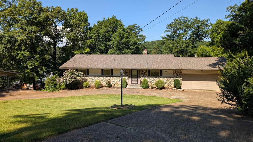 Lake Thunderbird - prime location for Fireworks viewing just down from the marina and dam. Conveniently located less than 1/2 mile from DG, Carol's lakeview restaurant. Only a few blocks to 2 other lakes for more fishing & boating. Updated roof, HVAC & state of the art septic system. Main level includes 2 bdr, 2ba, living/dining/kitchen and walk out to deck or 2 car garage. Circle drive and extra parking means room for guests or family to visit! Lower level has 2 more bdrs, another bath, plus family rm & 2 more areas for crafts, sewing or home school. More storage outside with your shed and a nice path from the garage all the way to the dock so you don't have to lift your cooler. All electric home with 2 units for zoned/energy efficiency plus 2 fireplaces (one w/insert)-1 on each level. List price incl all appliances: stove, microwave, fridge, dw several of which are recently updated. Although the seller has made every effort to maintain the home, it does need some cosmetic updates, especially in the basement. Make an appointment today to see the home in person!