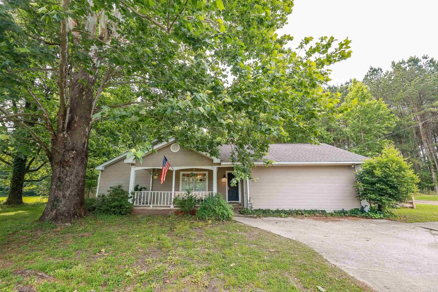 This charming, easy-care exterior home is the perfect blend of comfort, versatility, and convenience. Step inside to discover a spacious living room filled with natural light from the private backyard, with seamless flow to the open-concept kitchen and dining area—ideal for entertaining or everyday life.  Outside, discover your own backyard retreat: a lush oasis with multiple fenced areas, perfect for pets, play, or gardening. In one nook, enjoy a deck with hot tub, in another area make memories on the patio or around the fire pit. The detached garage offers generous extra storage, enhanced with a finished flex room that's ready to become your personal escape, creative studio, or workshop.  Whether you're looking to relax, host, or expand your hobbies, this home offers the space and flexibility to do it all.