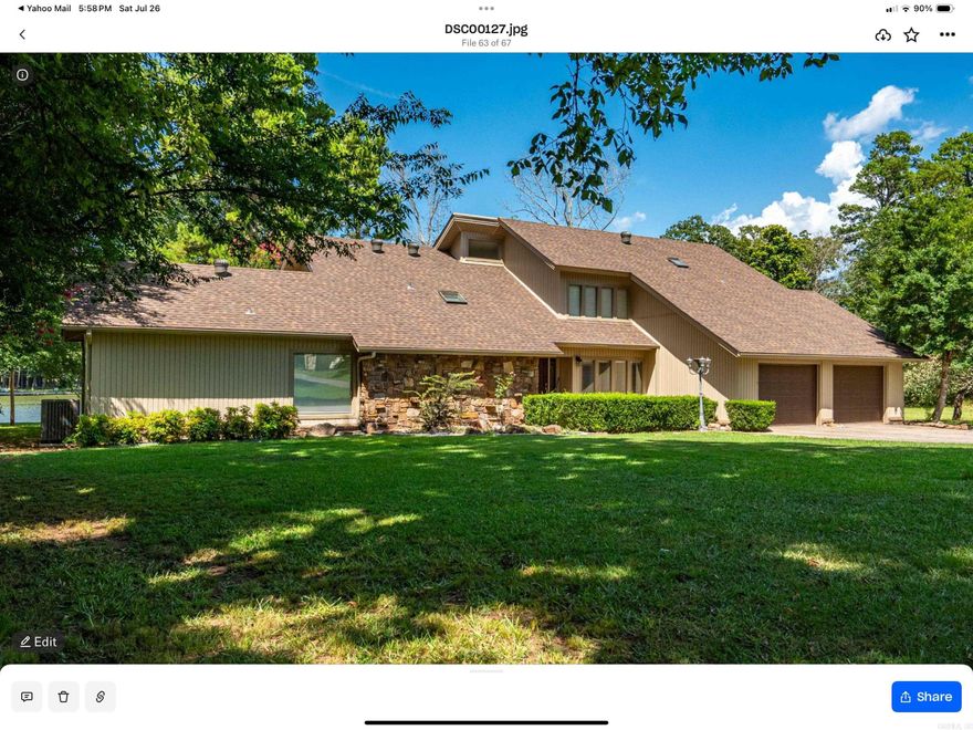 This beautifully updated Lake Hamilton home is set on 150 feet of prime lake frontage with a seawall, 75-foot boardwalk, and private boat dock. Over the last year, major improvements include a new roof, siding, gutters, windows, and fresh paint, making this home move-in ready and worry-free. Enjoy year-round comfort with a top-tier air purification system (REME HALO), commercial-grade Ultra Aire whole-house dehumidifier, and additional filtration systems. Step inside to a spacious great room with 20’ soaring wood ceilings, rich hardwood floors, and a stone fireplace with Buck Stove insert. The large primary suite includes a sitting area, lake views, and private access to a concrete patio overlooking the water. The home features two remodeled tile bathrooms, a formal dining room, and a well-appointed kitchen with breakfast bar, wet bar, and eat-in area. Entertain with ease in the 20x30 game room. Upstairs, you’ll find two generously sized bedrooms connected by a Jack-and-Jill bath, plus a floored walk-in attic for additional storage. Other highlights include a new 14x24 lakeside pavilion, a 12x24 side deck, laundry room, and a private office just off the kitchen. Agent is owner.