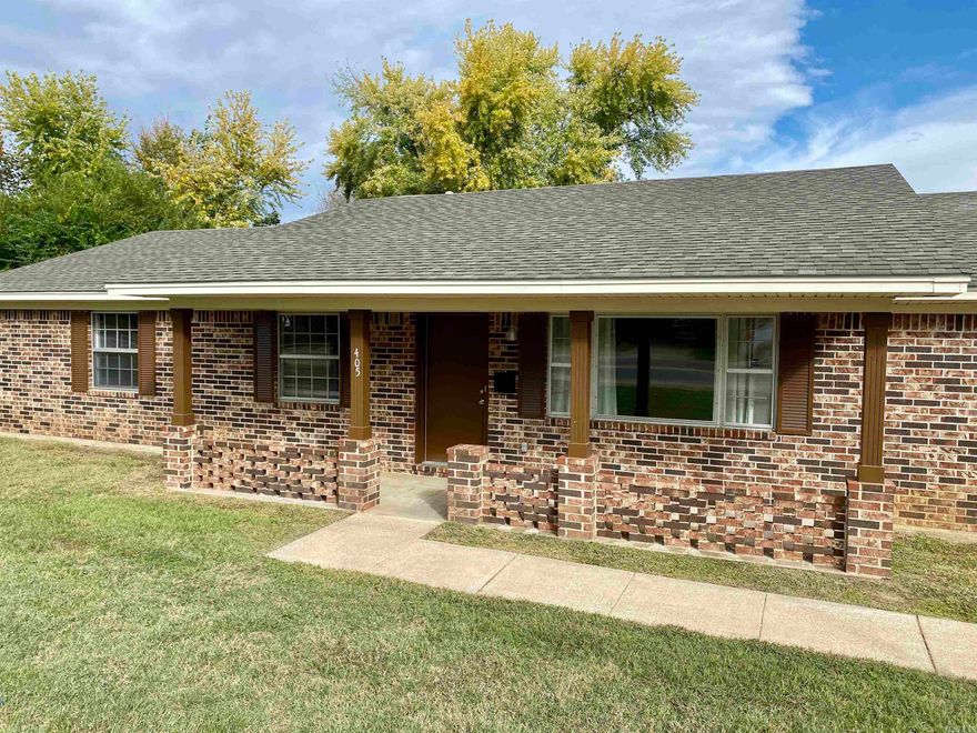 Tastefully designed & beautifully executed residence in Clarksville - centrally located between Historic Downtown & the hospital.  Minutes from the park!  Many updates:  New architectural roof, flooring, paint, appliances, & water main.  Simi-open concept w/ secondary living area including a wood burning fireplace.  Update kitchen w/ pantry & stainless steel appliances.  Adjoining oversized laundry w/ sink.  Storage off garage (new opener).  Updated baths include custom tile showers.  Spacious rear lawn w/ storage building & covered patio.  Schedule your personal tour today!