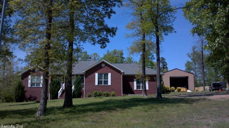 Tired of cramped subdivisions?  Totally updated one level home on over an acre but less than 10 min to I-30!  New flooring, new paint, new countertops, new appliances.  New 30x50 workshop!  Large galley kitchen with formal dining and dinette (or office).  Cedar sunroom overlooks large deck.  Additional 1.65 acre adjoining lot available for extra privacy!