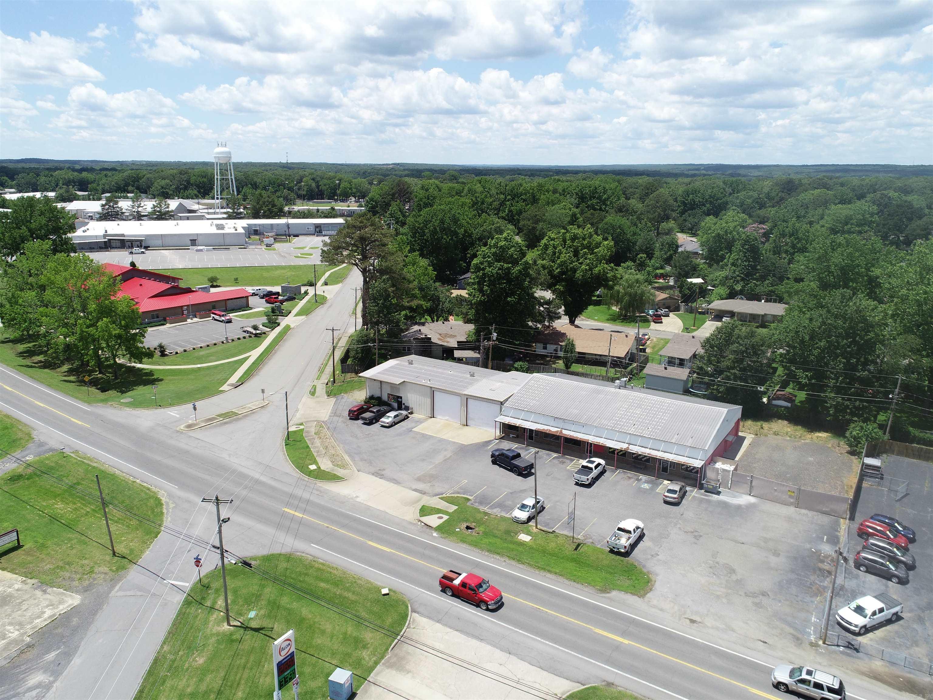 Income producing property in the heart of Cabot. 3 Separately metered spaces that are 100% occupied by 2 long term tenants. 4200 Sq ft Bait & Tackle Shop, 1200 Sq ft Retail Office, & 3,320 Sq ft pull through shop/warehouse. The Warehouse includes 1: 18' x 14' automatic overhead door, 1: 16' x 14' automatic overhead door, & 2: 10' x 10' manual overhead doors; plus 16' side walls & 18' center height. Large corner lot with 210' of Frontage on S. 2nd Street/Hwy 367, adjacent the Cabot Fire Department. Great visibility & access. Call today for more details!