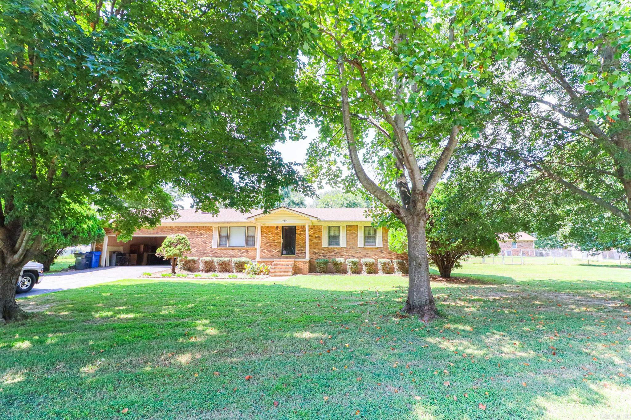Well-maintained, one-owner brick home offering 4 spacious bedrooms and 3 full bathrooms all on one convenient level. Nestled in a quiet, established neighborhood near Baptist Hospital, this property sits on a beautiful, tree-shaded lot that exudes charm and comfort. Inside, you'll find two master suites with exceptionally large rooms, a generous laundry area, and plenty of space for living and entertaining. Step outside to enjoy the wooden deck overlooking the large, fenced backyard perfect for gatherings or relaxing afternoons. A portable 10x10 shop building adds extra storage or hobby space. This is a must-see for buyers seeking convenience, comfort, and a welcoming community.