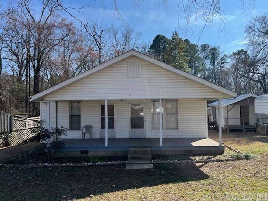 Nice frame home on the I-30 access Road. Detached carport and storage building are nice bonuses.