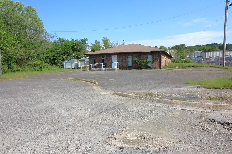 Commercial property on a cul-de-sac. Brick exterior, 2 central heat and air units.   Sitting on an almost acre of property, this is a great place to grow your business. Reception area, 4 offices, large 27x21 meeting room, kitchen, 2 bathrooms and 2 mechanical/storage rooms. A new roof is in the works.  Also included is a detached garage with garage door. Zoned M1.  Two storage buildings do not convey.
