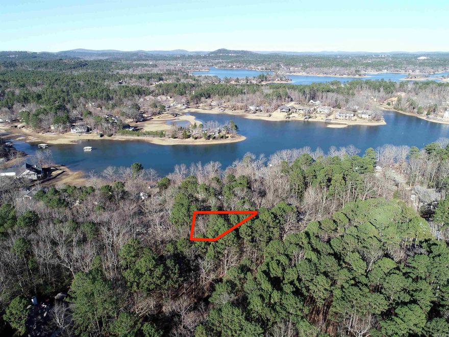 Build Your Forever Home in the Nation’s Largest Private Community.  Establish your household in Garland County with this perfectly positioned Lake View parcel. An open canvas for your custom home, this lot offers a sweeping view of Lake Balboa. Ownership of this parcel grants you access to a world-class lifestyle, featuring 11 stocked lakes, 9 championship golf courses, and a variety of amenities. Hot Springs Village maintains a fitness center, an indoor heated pool, racquetball courts, and more.  This particular parcel is about 33 minutes away from Hot Springs and about a 56-minute drive to Little Rock. Whether you desire a secluded forest retreat among scenic hills or a golfer’s sanctuary, this Hot Springs Village site offers exceptional living at an unbeatable price. There's a one-time buy-in fee of $300.00 on unimproved lots for new members to HSV collected at closing.