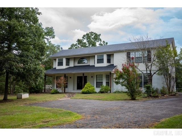 Come check out this beautiful 3 bedroom, 3 full bath home set back off the road for privacy. Home is on 3.03 acres with trees and large deck with gazebo for entertainment. As you enter the foyer you have double doors to the formal dining on one side and double doors to the office, library or den on the other side. Could be set up to make 5 bedrooms. Step down in to this large living room with cathedral wood ceiling and fireplace with open floor plan through dining and kitchen. Upstairs you will find a loft/game room or sitting room, hall bathroom, 2 bedrooms and the primary bedroom. The primary bedroom is huge with an amazing bathroom with his and hers sinks, separate shower room, soak tub and walk-in closets. New roof installed May 2024.