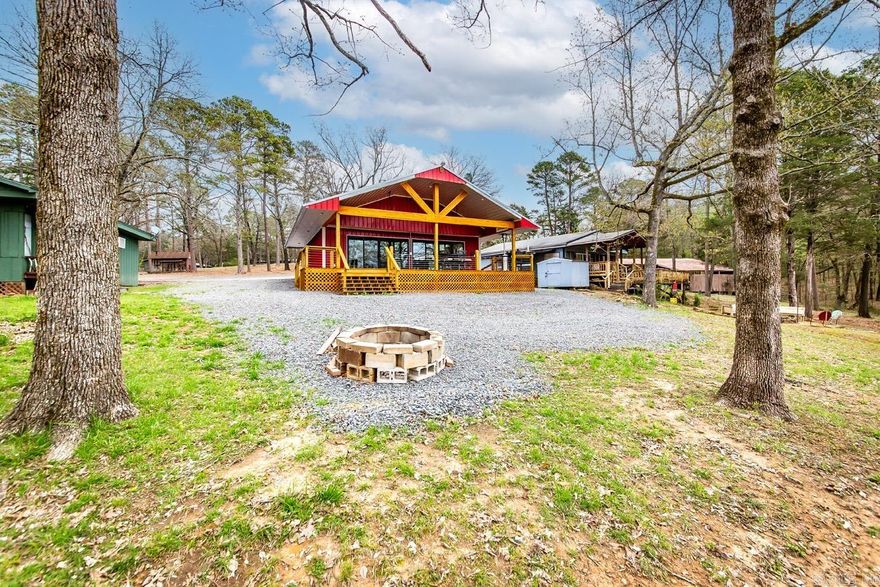 Escape to your own little piece of paradise in this charming lakefront cabin! Nestled on a gentle slop that leads straight to the water's edge, this freshly remodeled retreat is the perfect vacation rental for those seeking a peaceful getaway & income possibilities. Low maintenance & easy to care for, this cabin boasts granite countertops, large outdoor covered deck for entertaining, fire pit area, breathtaking views of the lake & surrounding natural beauty. Enjoy lazy afternoons on the deck, soaking up the sun & taking in the serene atmosphere. Located near the Narrows & Lacey's Marina, you'll have easy access to all the lake has to offer - from fishing & boating to swimming & water skiing. When the day is done, retreat inside to this cozy cabin where you'll find all the comforts of home. Don't let this opportunity slip away! Schedule your showing today!