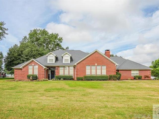 You have to see this large, well maintained home in Texarkana, AR on .75 acres! In addition to the four bedrooms and three full bathrooms, this home has a huge living room which is open to the large kitchen with plenty of storage and prep space as well as a bar with room for seating and a breakfast area. There is also a formal living or dining room, as well as a game room and an office. The spacious primary suite has a door to the patio, double walk in closets, a bathroom with double vanities, jetted tub, tile shower, and lots of storage. The two other bedrooms on this end of the house have walk in closets and are joined by a bathroom. On the other end of the house is the 3rd bedroom and bathroom, the office, and a large laundry room with room for hanging clothes, as well as a folding counter. The two car garage has an extra door for lawn equipment, as well as a storage/work room for tools, etc. The covered patio is perfect for entertaining or just relaxing to enjoy the big back yard which is surrounded by large trees and landscaping. There is a separate gated area for pets, as well as a small storage building. You won't believe all the space and storage has to offer!