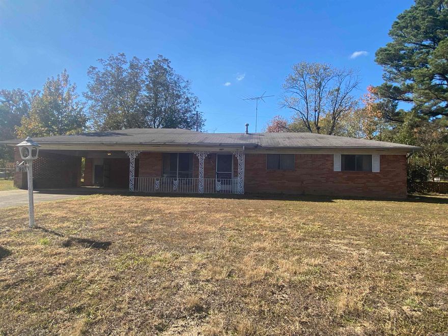 Take a look at this 3 bedroom 2 bath traditional style home in the heart of Arkadelphia.  You'll appreciate the natural light in the living and dining areas coming in from the large picture windows.   This home also features a separate laundry/mud room, covered parking, porches on both the front and back to enjoy mornings or evenings outside, and more.  With a little fixing up, this place could be brought back to life.  Agents, see agent remarks.