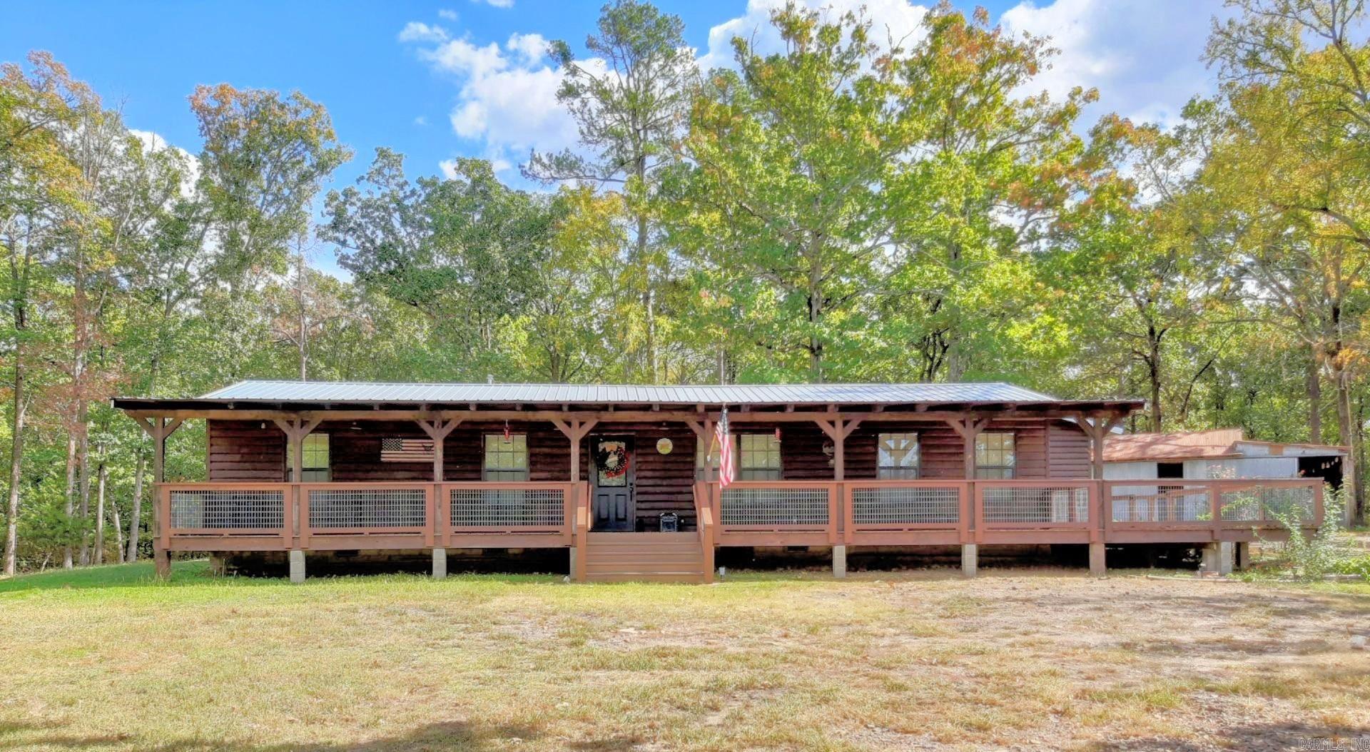 Charming Cabin on 4.46 Acres Along Highway 71 South ā Mena, Arkansas. This recently updated cabin sits on 4.46 partially wooded acres just south of Mena, offering both privacy and convenience with direct frontage on Highway 71 South. The home blends rustic charm with modern updates, making it ideal as a primary residence, weekend getaway, or income-producing Airbnb. Inside, youāll find a cozy layout with updated finishes, designed for comfort and easy maintenance. The improvements allow for a turnkey move-in experience, while the wooded setting provides peace and natural beauty. The acreage offers a mix of open space and mature trees, perfect for enjoying the outdoors, adding trails, or simply relaxing in a serene country atmosphere while still being minutes from town. Whether youāre searching for a personal retreat or an investment opportunity, this cabin delivers a rare combination of location, usability, and charm.