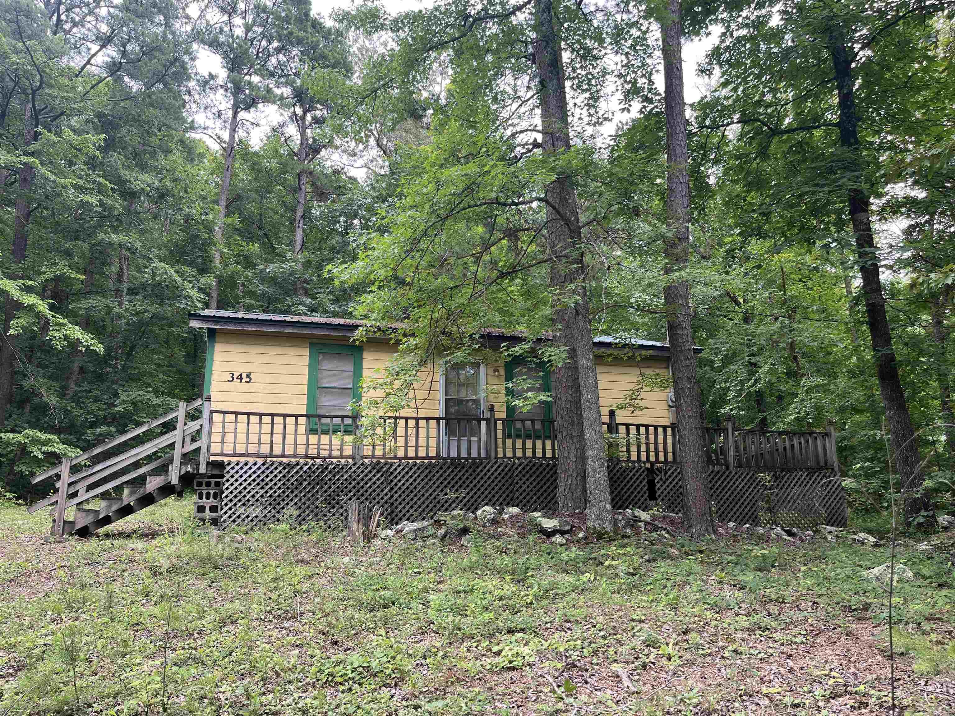 Fixer Upper! This cabin could be a super cute weekend get away or Airbnb but will take some fixing up. Selling AS-IS. One minute from boat launch! Water is on well but there is water across road.