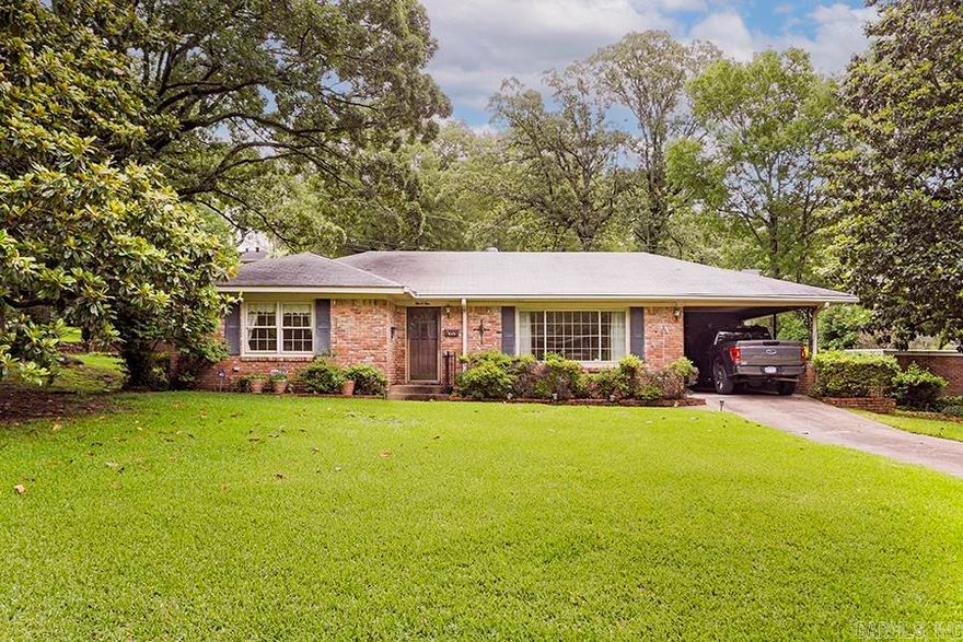 Discover this inviting traditional one-level residence nestled in a prime Midtown location. Offering great potential, this home is fully functional and ready for your cosmetic updates to make it your own. Enjoy two spacious living areas, perfect for relaxing or entertaining guests. The formal dining room adds a touch of elegance to your gatherings. The generously sized primary bedroom features a private ensuite for added comfort and convenience. A second bedroom overlooks the front yard, providing lovely, serene views. The hall bathroom boasts an oversized vanity and a shower-tub combo, ideal for family living. The well-equipped kitchen has easy access to the covered carport, making daily routines effortless. Newer windows flood the home with natural light and beautifully frame the flat, meticulously landscaped yard, complete with lush Zoysia grass—perfect for outdoor enjoyment. Don’t miss this opportunity to own a classic Midtown home with timeless charm and wonderful potential!