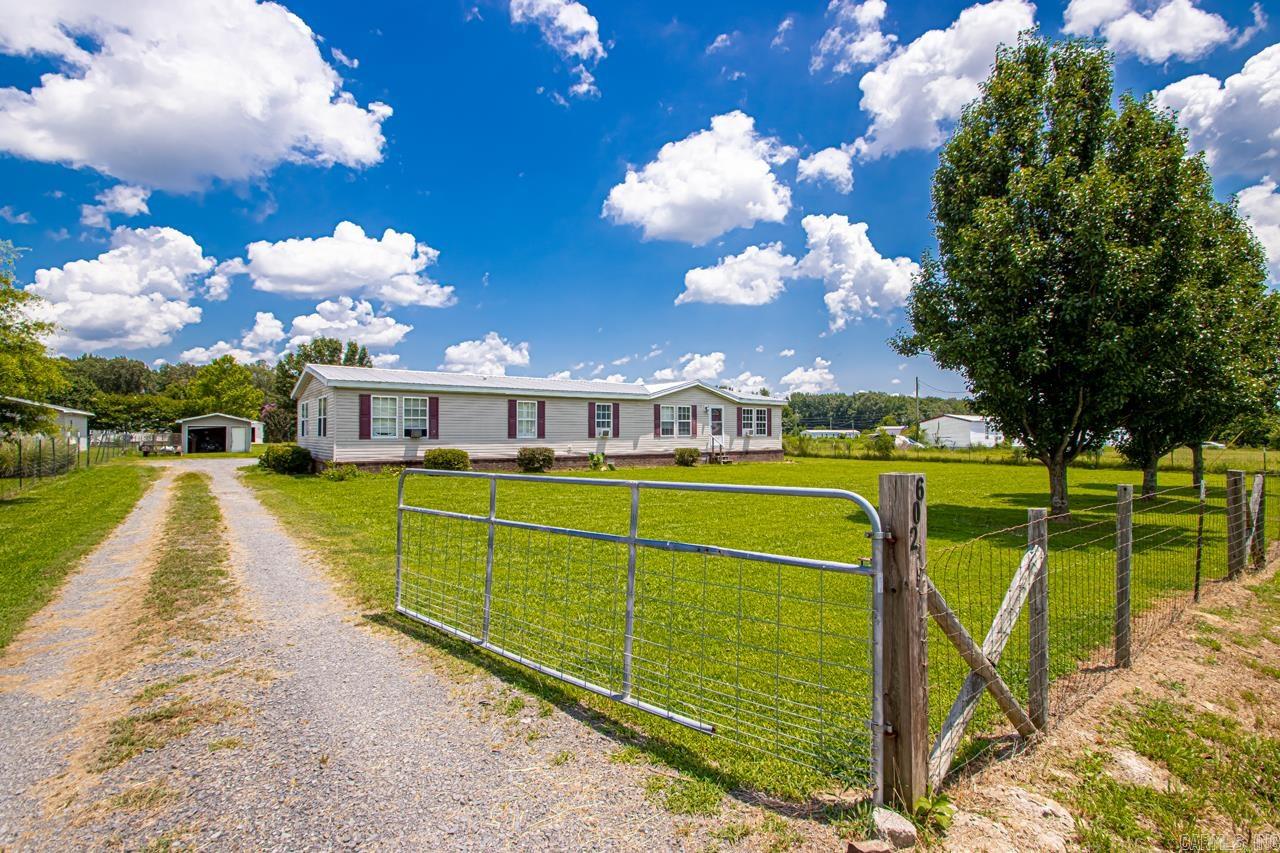 Spacious 4BR/2BA Home on 0.80 Acres with Shop & Deck! Donāt miss this beautiful 4-bedroom, 2-bath home situated on a generous 0.80-acre lot! Offering over-the-top comfort and space, this home features two large living areas, and a bright, open floor plan perfect for modern living. Updates include a luxurious walk-in shower and Jacuzzi tub, fresh paint throughout, and a new metal roof installed in 2019. The heart of the homeāthe kitchenāboasts gorgeous cabinetry, stainless steel appliances, and abundant storage for all your culinary needs. The primary suite is a true retreat with a spacious ensuite bath and a HUGE walk-in closet. Step out back to a large deck, ideal for relaxing evenings or weekend entertaining. Bonus features include a shop for your projects or storage, and plenty of outdoor space to enjoy country-style living with modern comfort.
