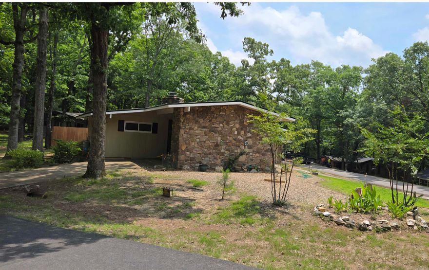 Step into this adorable  3 bedroom home that blends cozy charm with functional space. The open concept living and dining area is perfect for entertaining or relaxing by the wood-burning insert fireplace. Enjoy cooking and gathering in a layout that flows seamlessly throughout. A covered patio offers the perfect spot for morning coffee or evening BBQ's The home also features a carport and a 2 car garage on side providing ample parking and storage. Also Generous yard space for planting flowers of vegetable garden or just enjoying the sunshine! Don't miss out on this well loved home with plenty of charm!! $2000 buy in fee at closing