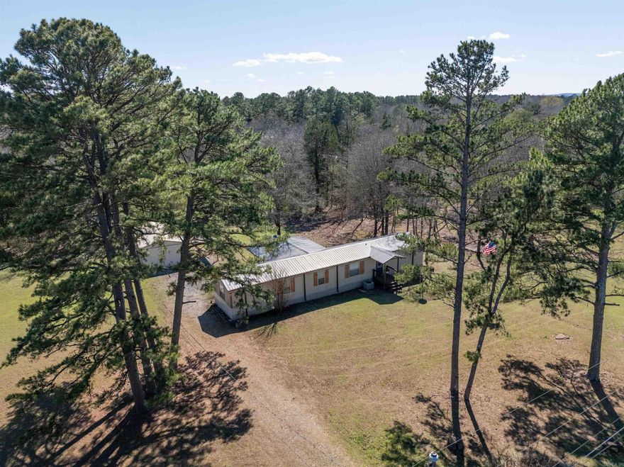Furnished single-wide mobile home in great condition on approximately 0.77 acres, located just 1.7 miles from Old Hwy 25 boat launch on Greers Ferry Lake. Move-in ready and ideal for a full-time residence, weekend retreat, or investment. Features include a back deck for relaxing, fenced area for pets, and a detached garage with electricity for storage or workspace. Convenient lake access with room to enjoy the outdoors. Two additional adjacent lots to the right are also available for purchase.