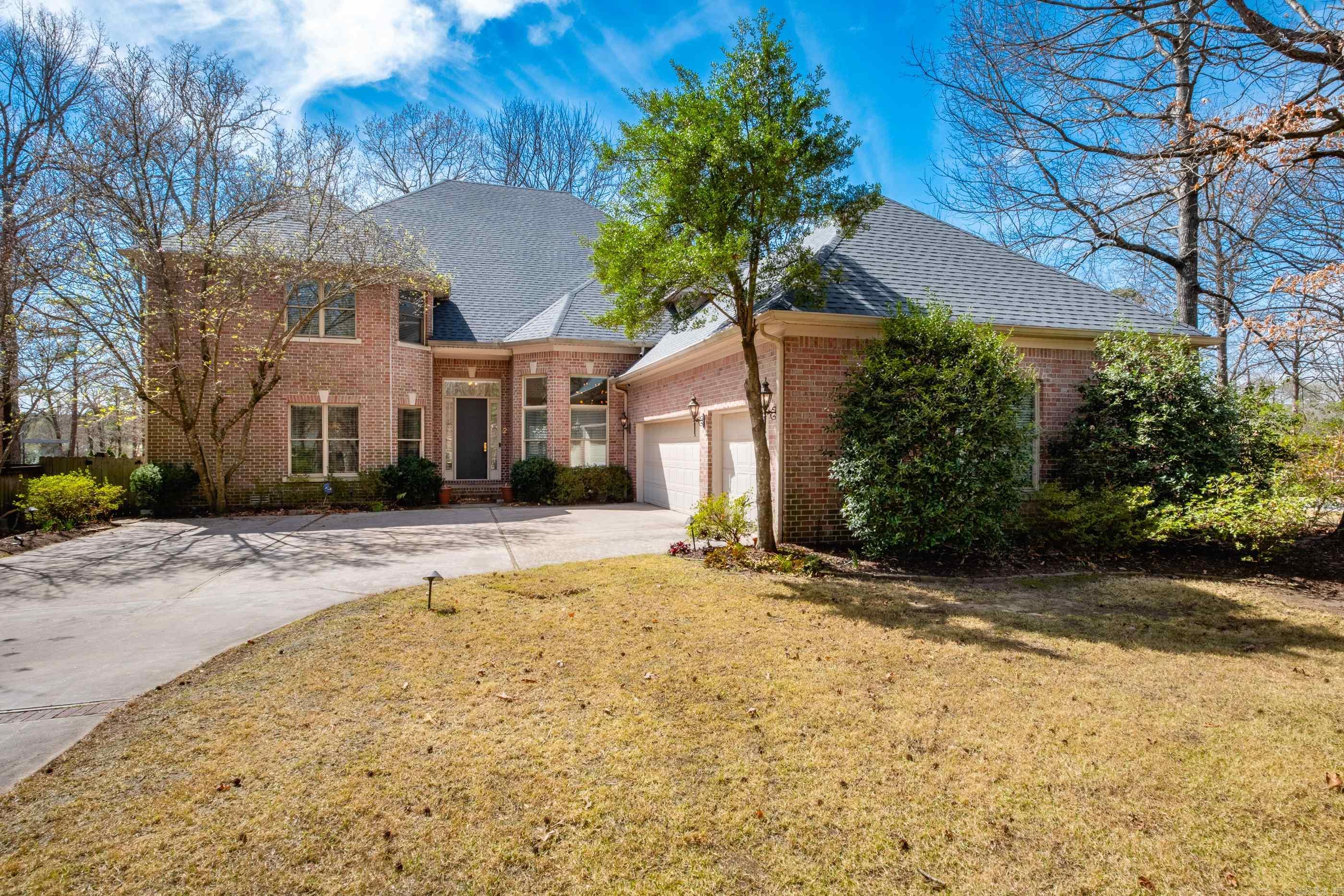 Wonderful oversized level lot situated on Chenal Country Club's Founders Course. Spectacular expansive views from two covered patios and lush landscape. Updates to soft contemporary include kitchen renovation; modern fixtures, white wash hardwoods, paint, doors, cabinets, refaced columns, upstairs jack & jill bath, sonic ice machine, waterfall island, and fireplace. Versatile family home, 2 laundry rooms, 2 game rooms, executive office, enormous walk-in attic, 2 - 50 gallon HWH's with circulation, sprinkler, iron fenced backyard, new roof in March 2025, Lovely family retreat!