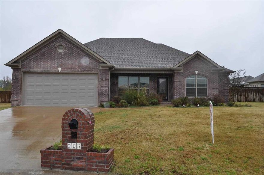 Absolutely beautiful all brick home only a year old! Open floor plan w/fireplace in living room, recessed lighting, kitchen has stained cabinets, upgraded stainless steel appliances, wall oven, pantry, granite, pretty backsplash, an island, hidden spice cabinets that you will love! Built in surround sound, bronze hardware, crown molding everywhere! Master suite has tray ceiling, master bath offers shower built for 2, walk-in closets, double sinks.  Large patio overlooks fenced yard & water view.