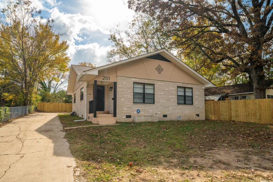 This is a MUST SEE, Charming Fully Renovated 4-Bedroom, 3-Bathroom Home With Custom Tile Baths & Modern Upgrades! Welcome to 261 a beautifully updated home that blends modern comfort with timeless style. This spacious 4-bedroom, 3-bathroom property offers a warm, inviting layout with thoughtful upgrades throughout. Step inside to an open, airy living space featuring new flooring, recessed lighting, and plenty of natural light. The large living room flows seamlessly into the dining area and an impressive custom-designed kitchen, complete with expansive butcher-block countertops, stainless steel appliances, abundant cabinetry, and open shelving, perfect for cooking, entertaining, and everyday living. Each of the three bathrooms has been fully renovated with custom tile work. The home’s generous bedrooms provide comfort for family, guests, or a flexible setup for extra space with a bonus den area. Outside, you’ll find a freshly fenced backyard, new HVAC, new roof and a long driveway offering plenty of parking all just steps from Oaklawn and centrally located to everything in town. This home is move-in ready and truly one of a kind!