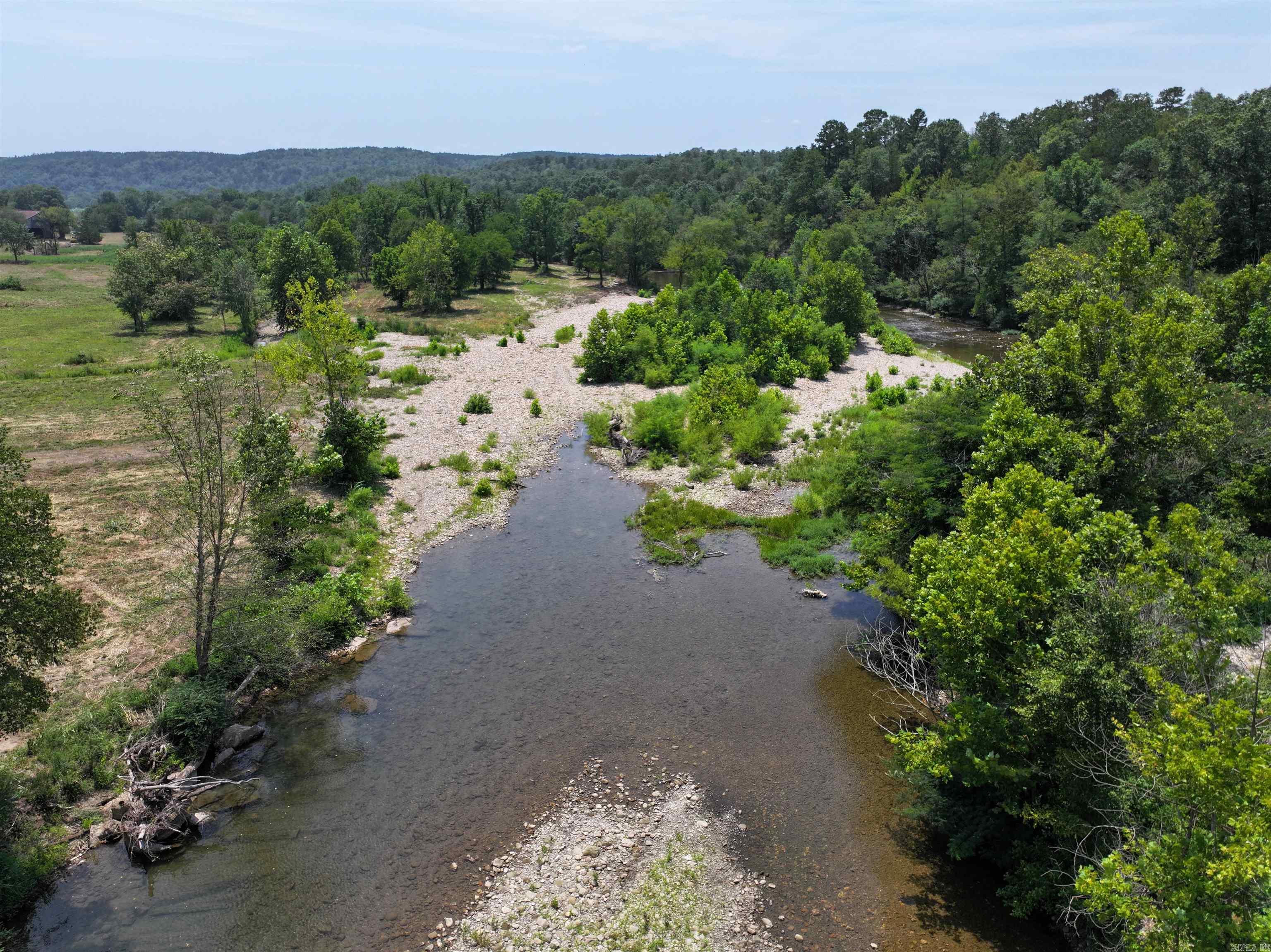 Discover the perfect blend of natural beauty, relaxation, and outdoor adventure with this stunning riverfront property in Norman, Arkansas. Nestled along the scenic Caddo River and surrounded by the majestic Ouachita Mountains, this property offers an exceptional setting for anyone who loves the outdoors.  Enjoy direct river access for floating, fishing, or simply soaking up the peaceful sounds of nature. This setting currently offers a 3+/-  acre tract, with the option to purchase additional acreage if desired.  With thousands of acres of national forest nearby, endless opportunities for hiking, exploring, and wildlife watching await right outside your door.  Located just a short drive from Mount Ida, the āQuartz Crystal Capital of the World,ā you can even spend the day digging for your own treasures. Whether youāre envisioning a vacation getaway, investment opportunity, or future homesite, this property invites you to experience the best of Arkansasās natural charm, where relaxation meets adventure.  AGENT SEE REMARKS