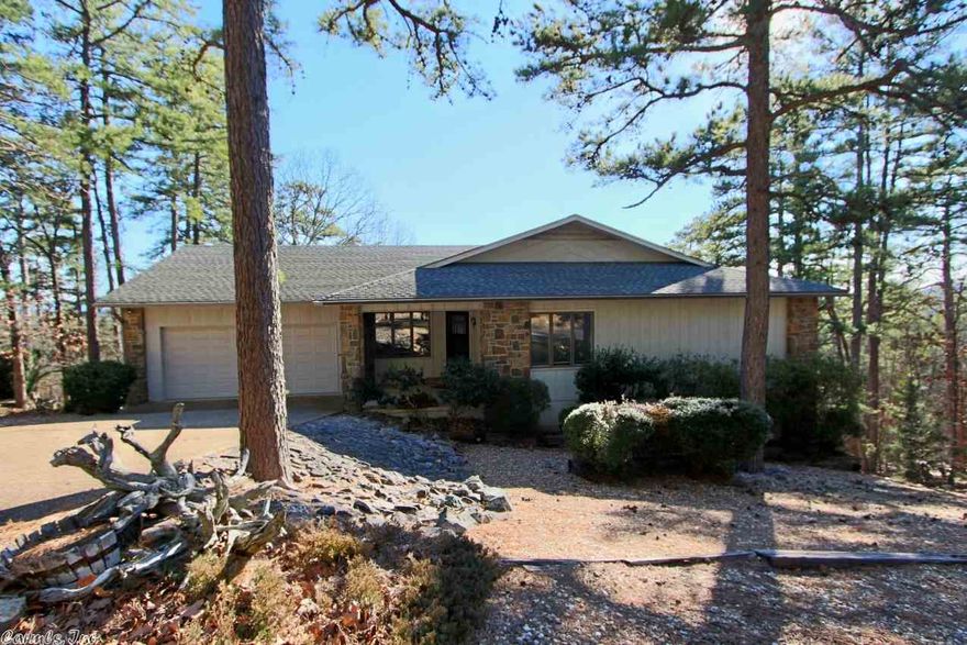 Enjoy the mountain view from your large decks. Open floor plan with split bedrooms on the main level. Cozy corner wood burning fireplace. The dining area features a bay window. Eat in kitchen. Walk in shower in master bath. Big garage with extra storage. Second living area and office on lower level. Perfect for hobby or media room.