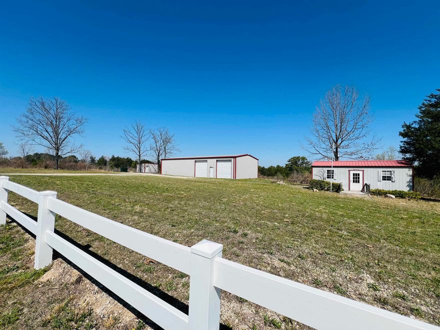 Versatile live/work opportunity on approximately 16 acres of half timber and half cleared land! This barndominium style property is ideal for those looking to combine business and residential living in one location. The 1,200 sq ft living area offers 2 bedrooms and 2 bathrooms, while the attached 1,200 sq ft workshop with CAR LIFT provide4s the perfect setup for a mechanic shop, hobby space or small business operation. Two additional outbuildings offer even more flexibility for storage, office space, or expansion. With plenty of room to grow and easy access, this property is well suited for entrepreneurs, tradespeople, or anyone seeking a functional workspace with living quarters on site.