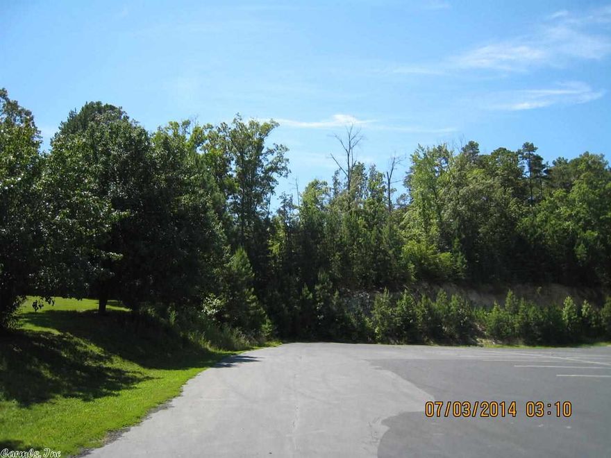 6.9 acres MOL in the Mountain Pine School District.  The property is located behind the Harvey's Chapel Baptist Church.  Property is wooded with both pine and hardwoods.