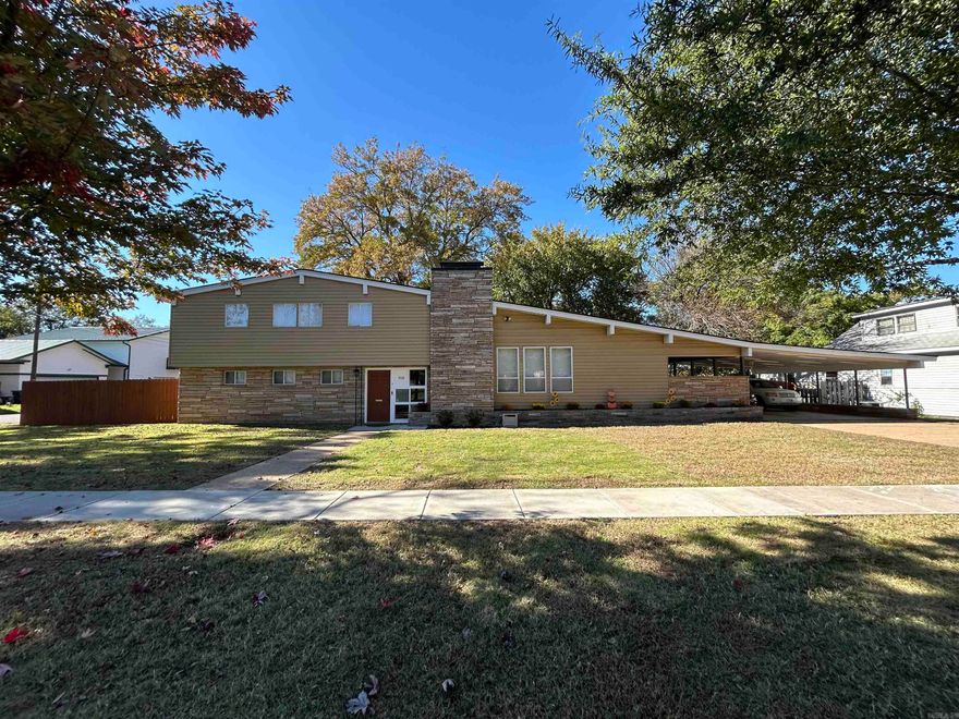 This is a remarkable home that makes you feel like 1970, but with all the modern appliances, electrical, and plumbing of modern homes. Very contemporary floor plan made for families to enjoy the massive living room with electric fireplace and stacked rock accents, gleaming hardwood floors, lots of natural light. The dining area right off the kitchen. 2 half baths for guests to wash up, and a modern kitchen for multiple cooks. Added details/ wall storage. An Electric cook top, wall oven for those holiday meals, Dishwasher, lots of counter space. Step down you have the laundry room with its own folding table, and a large amount of storage. The basement play room and workroom are off this level.The main level we have the two living areas, a mother's quarters with her own walk-in shower, and backyard access. Upstairs we have three more bedrooms and a Jacuzzi tub bath, all with gleaming hardwood floors. An extra fold out closet+ extra huge closet, plus a balcony to look out to the oversized back yard.