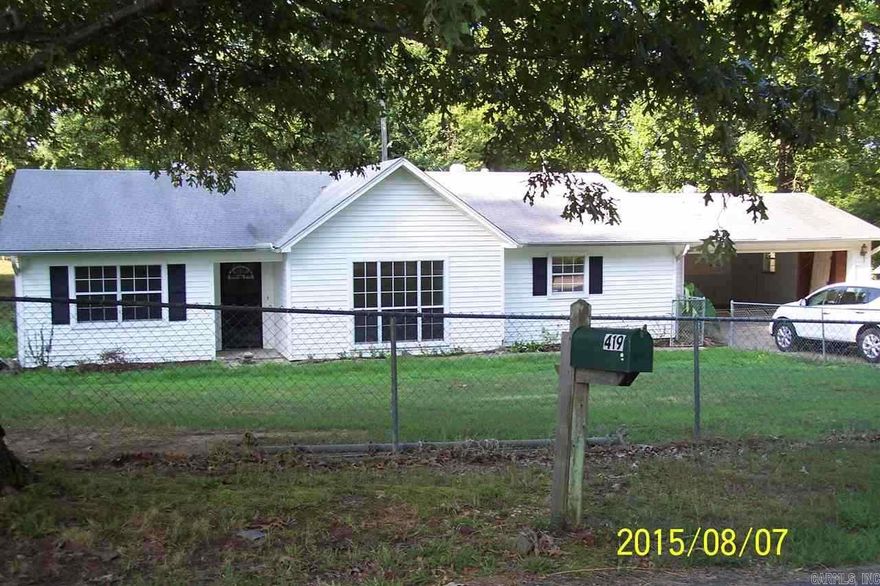 IF you are looking to live out but still be near town this is your home. This 3 Bedroom/2Bath home sits on .66 acre.  Large Living Rm and a huge Master Bedrm. Freshly painted and new garage door and shutters. Almost 1800 Sq Ft for $95,000. One year Home Warranty is being provided by Seller.Recent updates of a New Dishwasher, Sink, Disposal and Counter Top plus 3 new steel exterior doors. All this and no price change.