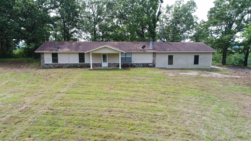 Scenic 3-Bedroom Home on 5+ Acres with Cadron Creek Frontage  Nestled atop a ridge with stunning views of Cadron Valley, this 1482 sq ft, 3-bedroom, 2-bathroom home offers a unique opportunity to own a slice of nature. Set on over 5 acres with Cadron Creek frontage, this property is perfect for those seeking tranquility and natural beauty. Located between Conway and Greenbrier, in the desirable Greenbrier school district, this home provides both convenience and seclusion.  The property is being sold "as-is, where-is, with all faults," and the seller has never occupied the home, so no property disclosure is available. Public water, power, and high-speed internet are available, ensuring modern conveniences. Buyers are encouraged to conduct their own due diligence during the inspection period.  Embrace the potential of this picturesque lot and make it your own. Schedule a viewing today to experience the breathtaking views and endless possibilities!