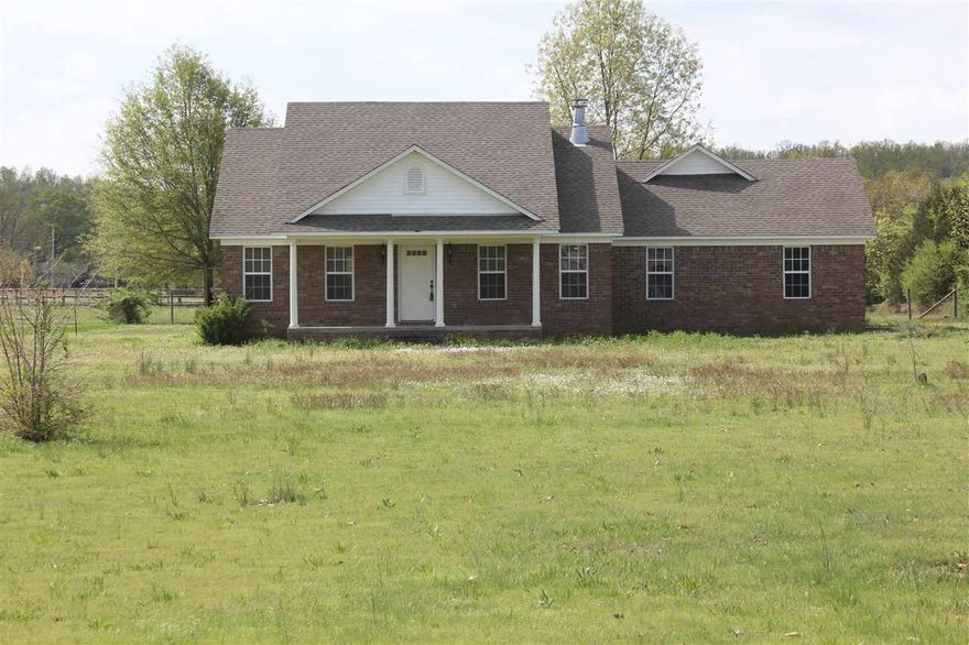 Looking for a home with some land...then this is it! 3 bedroom/2 bath home built in 2006 on 3.7 acres. This home boasts a split bedroom floor plan, separate jacuzzi tub and shower in master bath with 2 sinks, eat-in kitchen with brand new stove (April 2015) and brand new hot water heater (2015). No carpet in this home and you will have plenty of room in the oversized garage. Property is cleared, level and nutrient rich for your future garden. Horses allowed. SELLER WILL ALLOW FOR A PAINT ALLOWANCE!