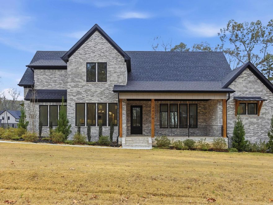 Located on a corner lot just over an acre in the desirable Avilla Manor subdivision, this nearly 3,200± sq ft home blends timeless elegance with everyday functionality. Lush landscaping and a sprinkler system create impressive curb appeal, welcoming you inside to a bright, open interior filled with natural light from Andersen Low-E casement windows. The thoughtfully designed floor plan showcases quality finishes throughout, including wood flooring and custom built-ins. The kitchen features granite countertops, a spacious walk-in pantry, and room for gathering, while the living room is centered around a cozy gas log fireplace. The primary suite offers a vaulted ceiling and a spa-inspired bath with a custom tiled walk-in shower. Upstairs, three spacious bedrooms and a versatile bonus room provide flexible living options. The main level also includes a dedicated office and a large mudroom. Energy-efficient features such as foam insulation and a tankless water heater enhance comfort year-round. Enjoy outdoor living on the covered back porch and the expansive lot—ideal for a future pool or shop. A 3-car garage completes this exceptional home.