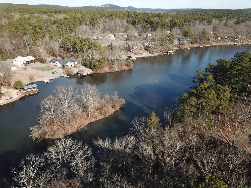 Great opportunity to purchase lake front property on Lake Pineda.  Want more space?  The lake lot next door (26 Cuenca)  is also available for sale.  Lot is centrally located and just minutes from the Coronado Fitness Center.   Hot Springs Village is a gated community with 9 premium golf courses; 12 lakes; 30+ miles of walking trails; fitness center with indoor pool; tennis center and so much more!  Come see all that the Village has to offer. See Associated Documents for copy of Elevation Map showing slope on lot.  Measurements are in 2 foot increments.