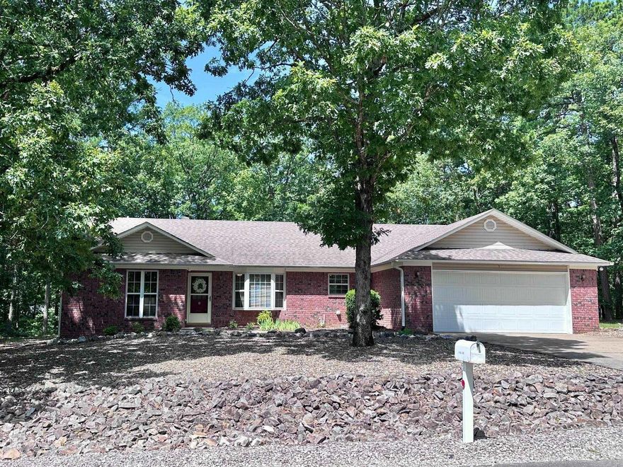 NEW ROOF/GUTTERS & DOWNSPOUTS AUG 2025!!!!  Charming one-level traditional home on slab foundation with level driveway and spacious 2.5-car garage—perfect for your golf cart or extra storage. This split 3-bedroom, 2-bath layout offers privacy and functionality. The natural surroundings provide beautiful, low-maintenance landscaping, and the large backyard offers space to add a fence for pets. Enjoy relaxing or entertaining on the covered back deck with added privacy from common property on two sides. Ideally located near the West Gate with quick access to shopping, pickleball courts, pool, lakes, and trails. Whether you're looking for a full-time residence or a quiet retreat, this home offers comfort, convenience, and a peaceful setting in a highly desirable area. A must-see!l