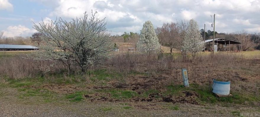 3-bedroom, 2-bath 1993 mobile home offering approximately 1,196 sq ft, set on about 33.5 acres with a versatile collection of improvements. The property includes roughly 900± feet of Brushy Creek frontage, a 400×40 metal truss storage barn, 56×60 pole shed, 26×24 carport, 10×20 storage shed, and an additional 8×10 storage building. There are three wells, a small pond, and several fruit trees on site. Located about 1 mile from the Ouachita National Forest and approximately 3 miles from the Ouachita River. No restrictions, providing flexibility for a variety of uses.