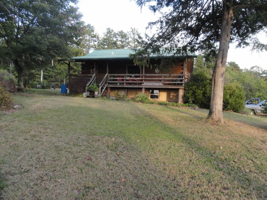 A 40 acre gem of a property with a great view in the Diamond State surrounded on 4 sides by Ozark National Forrest where you have 1,000’s of public acres to hunt, hike, explore & ride horses on. Boston Mtn Horse Camp 1.5 miles away. This property “is not” a Diamond in the Rough, it is already beautiful and “move in ready”. This property is truly unique & literally gave me an “at home” feeling when I drove up to the cabin. The home is a “true log” log cabin, 4 bed 2 bath, 2240 sq ft, central propane heating, central cool, 4 propane backup heaters, Generac propane whole house generator in case electricity goes out, rainwater catch system, old drilled well (not in use), covered front porch that showcases the wonderful view where you will be able to enjoy stunning sunsets & watch the deer & other wildlife from. The property also has a chicken coop, 40x24 barn, huge 28x120 Quonset shop building with its own bathroom/ofc/living quarters area. The shop has a work area heated by an oil fired heater & a 9000 lb truck lift as well as an air compressor along with lots of shelves. The farm has 25 acres M/L cleared pasture grass from which they cut hay as well as 2 ponds & cross fencing.
