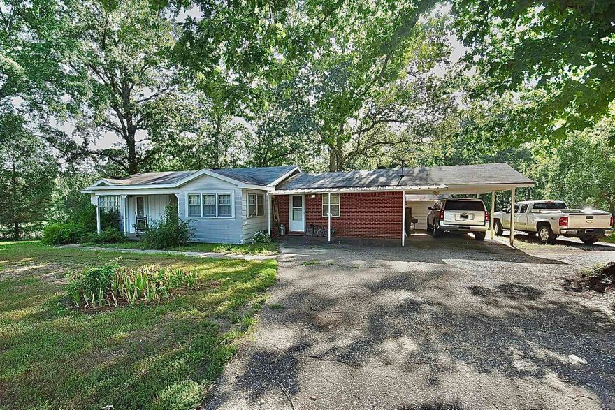 Want visibility? This 4-bedroom, 2-bath home sits on 3.47 acres along high-traffic Highway 270, offering exceptional exposure in a rapidly growing area. With approximately 330 feet of highway frontage, this property is ideal for buyers seeking a highly visible location. Just a 4-minute drive from the Walmart Supercenter in Malvern, along with numerous other growing businesses in the area. Public water and sewer are available at the road. The home features a private living room, an eat-in kitchen, and a back porch to enjoy the large back yard. Four sheds are featured on the property offering plenty of extra storage. Opportunities like this don’t come often—prime location, plenty of space, and built-in exposure.