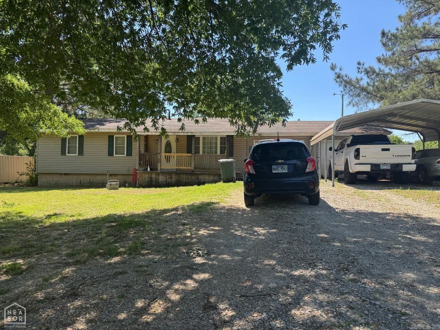 Located on Manley Lane in Brookland, this property offers a rare opportunity inside the city limits with approximately .97 acres, more or less providing a near one-acre lot that gives a country feel while still being convenient to the amenities of town. The home features approximately 1,700 sq. ft. of living space with 3 bedrooms, 2 bathrooms, and two separate living areas. A large den on the back of the home includes a free-standing wood stove, adding character and functionality. This property is well suited for investors or owner-occupants looking for a value-add opportunity. With some remodeling, this home has strong potential and is priced aggressively so a new owner can remodel and make it their own.