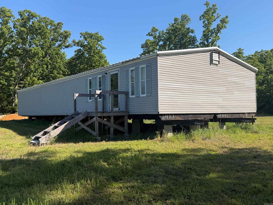 5 +/- Acres on Hwy 167 & Campground Rd | Mobile Home, Utilities & Shop Located on the corner of Highway 167 and Campground Road, this 5 +/- acre property offers excellent visibility, accessibility, and flexibility for a variety of uses. The property includes a 28x76 double-wide mobile home (bill of sale only) previously used as a medical facility. While not currently connected, utilities are on site and ready for hookup. With its size and layout, the mobile could easily be converted into a spacious residence or an ideal deer camp. Improvements include a septic system, water on site, and an electric post ready to go. Additional features include a shop with concrete floors, two cargo storage containers, partial pipe fencing on two sides, Highway 167 frontage, and a gated entrance off Campground Road. This is a versatile property with strong potential in a highly accessible location. Agent-owned property.