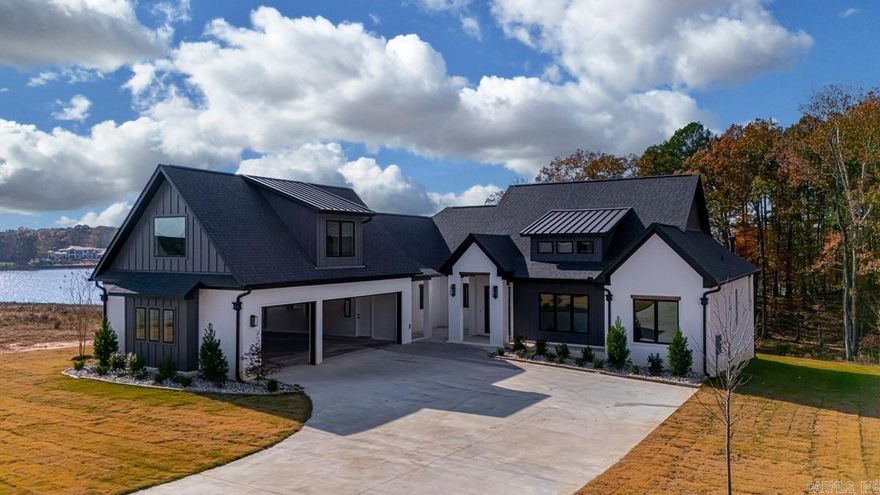 Here is something you don't find everyday.  A new construction ON Hurricane Lake.  This home has it all with stunning views.  The home boasts a beautiful back porch perfect for entertaining or just plain relaxing with outdoor kitchen, and fireplace, 15' trifold door, and as mentioned stunning views.  The kitchen is a dream with custom cabinets, hidden pantry, huge double-sided island with quartz tops, professional grade appliances, and an accent wall.  Custom lighting throughout the house, with low sensor lighting in the bathroom, and accent lighting in the primary closet.  3 bedrooms with an office (or 4th bedroom) downstairs, and bonus room with a full bath.  Still some things to be picked out to make it even more custom.  This is a must see!