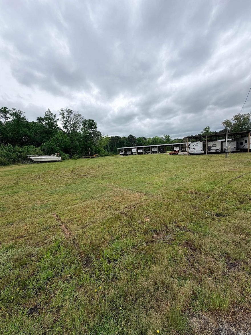 Don't miss your opportunity to own this awesome mini storage and boat/RV storage facility located in the rapidly growing community of Haskell, AR. This fenced and gated property sits on five plus acres and currently has 40 10x10 storage units and 31 covered units for RV and boat storage. The remainder of the five acres is cleared and there is ample room to add more RV storage units. Taxes are estimated as they are currently included with other property at this time. Over 18,000 sq/ft of either mini storage or covered RV storage. No sign located at the property. A portion of the property is in the flood zone. Not the area where the storage units are. Look for the J&C Sign.