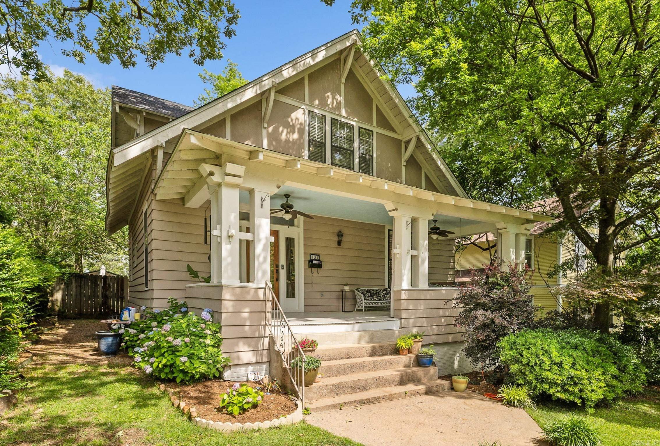 UPDATED CRAFTSMAN HOME IN HILLCREST! Step into this beautifully preserved Hillcrest Craftsman, brimming with nearly 100 years of character and charm. From the moment you arrive, the welcoming covered front porch with swing and wooden front doors set the tone for timeless appeal. Inside, you’ll find tall ceilings, original hardwood floors, and a spacious dining room that flows seamlessly into the fully updated kitchen—complete with granite countertops, stainless steel appliances, and a large walk-in pantry. Upstairs features three freshly painted bedrooms with brand-new carpet. A second story sunroom makes the perfect little art studio, office, or craft room. Recent updates include a new roof and 2 HVAC systems (one upstairs and one downstairs) installed within the last year. Outside, enjoy a private backyard oasis with a concrete patio and fire pit area, ideal for entertaining. All of this in a prime location—just a short walk to Hillcrest’s shops, restaurants, and parks!